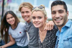 Portrait of teenage friends with arms around in the city. vaping general dentistry dentist in Hendersonville South Carolina